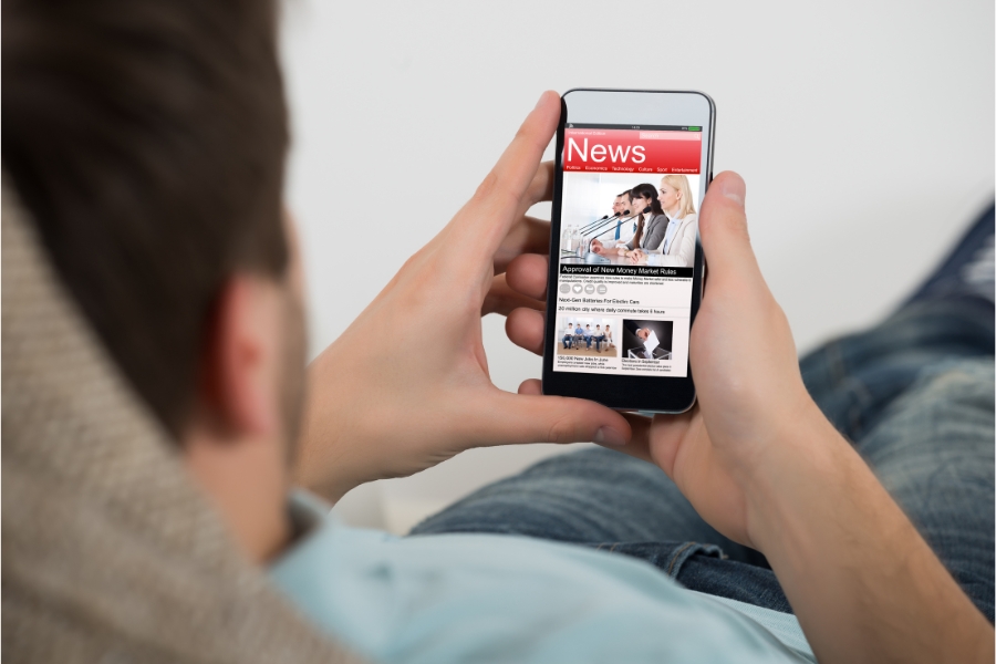 Man reading news on phone
