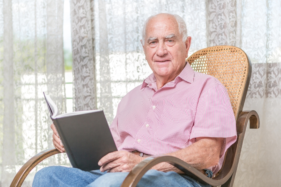 Mature gentleman reading at home