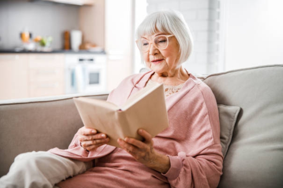older lady reading at home
