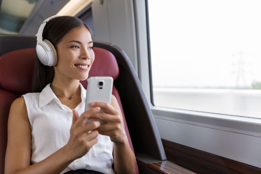 Lady listening on her headphones