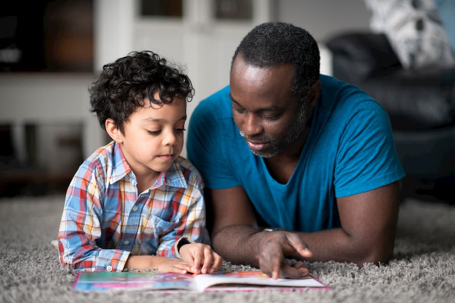 Dad reading with son Dad reading with son