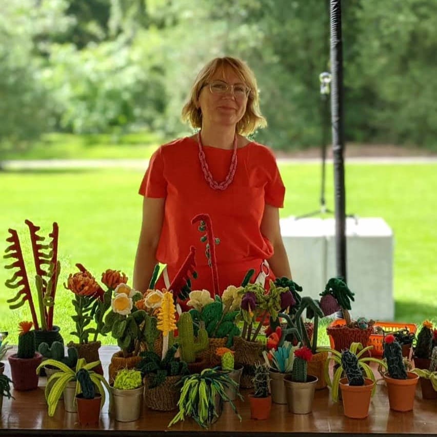 Clare Sams square resize Clare Sams with a display of crochet house plants