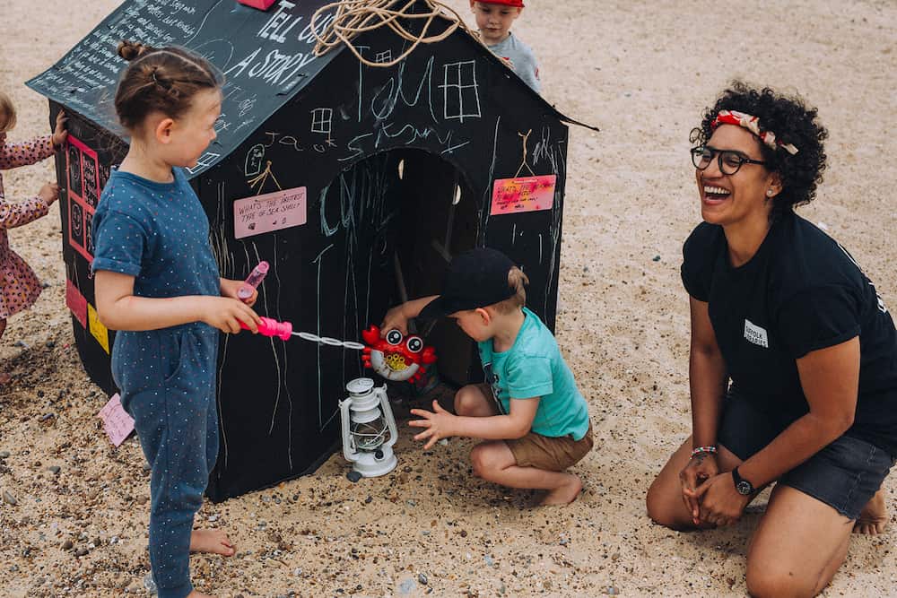 Kirsty Tallent beach resize Kirsty Tallent, previous Storyteller in Residence, facilitating a beach activity for children