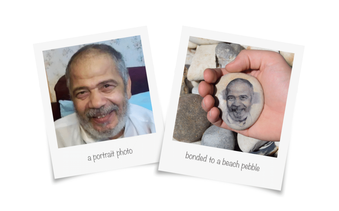 Picture of a memory pebble showing the face of a loved one.