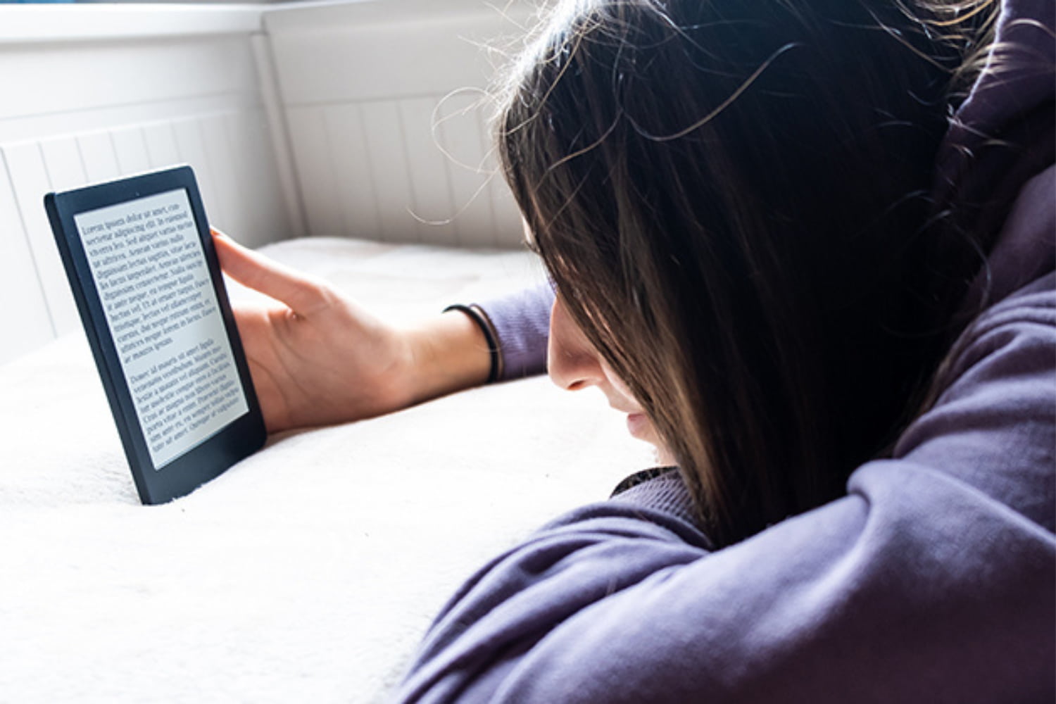 A young woman reading an ebook 