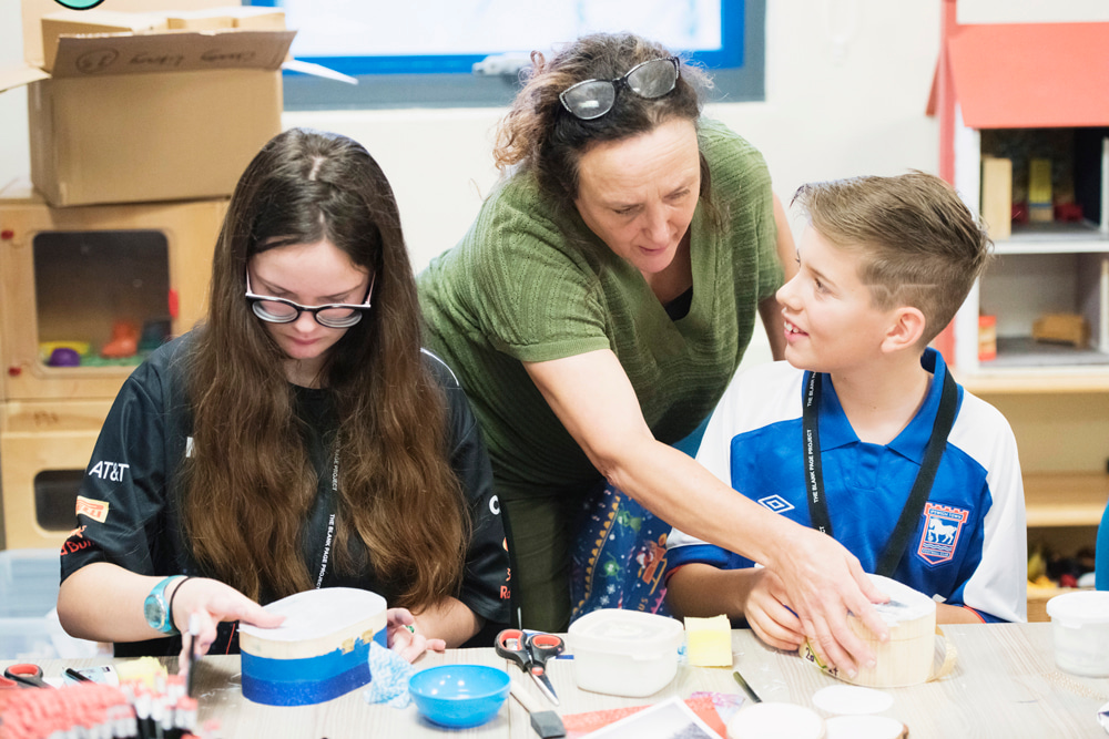 A picture of young people enjoying a blank page workshop
