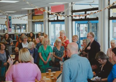 Attendees gather round to celebrate the 50th birthday of Lowestoft Library.
