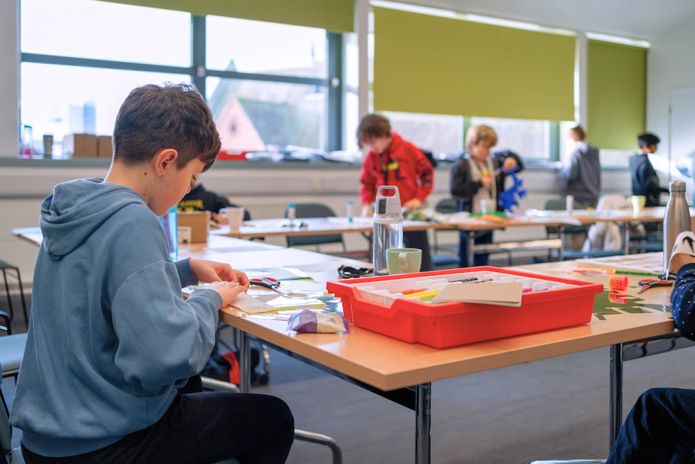 A group of boys taking part in a creative workshop at Ipswich Library